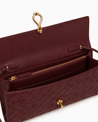 Woven Leather Top Handle Clutch with Sculptural Knot Closure