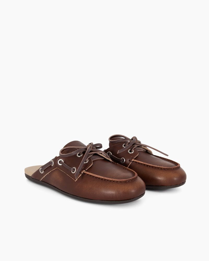 Pair of brown leather shoes on a white background