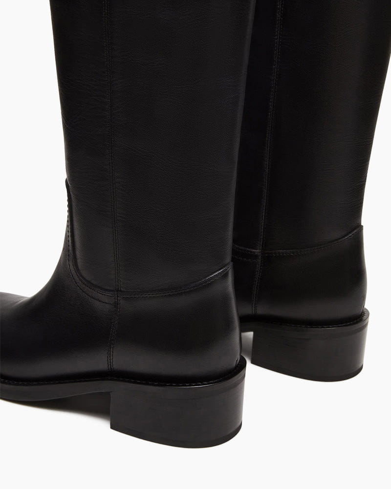 womens-airport-outfit-sophisticated-tall-square-toe-boots